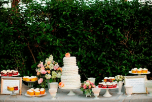 A cake and cupcakes off guests a choice Image provided by Colette's Catering