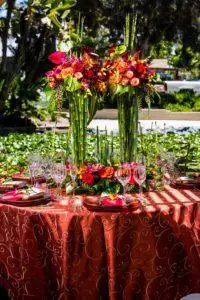 Pair tall rushes with lush tropical blooms for a stately feel. Design by Lois Mathews Floral Design Photography by Kristina Chartier Photography