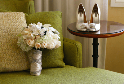 Rhinestone wrapped bouquet ties in with accessories. Image provided by Joel Austell Studios