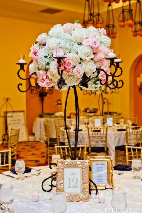 Wrought iron makes a beautiful basis for a dramatic centerpiece. Image provided by: Organic Elements